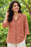 Young adult Indian woman wearing the Zig & Zag hand block printed shirt outdoors